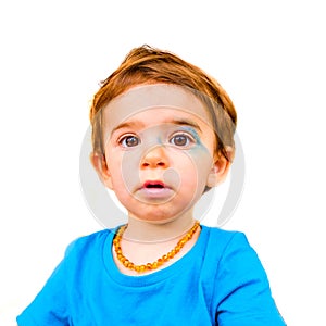 Innocent baby face isolated painted blue face expression newborn