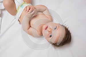 Innocent baby lying in crib