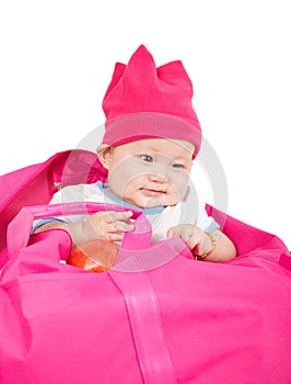 Innocent baby in a pink bag