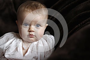 Innocent baby portrait with blue eyes