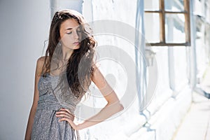 Innocent woman with flying curly hair