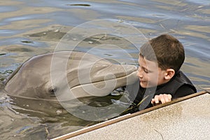 Innocent Young Boy with a Dolphin