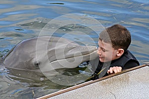 Innocent Young Boy with a Dolphin photo