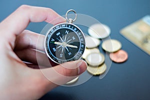 Innovation concept: Man is holding a compass in his hand, closeup cutout