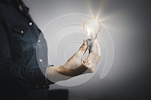 the innovation and inspiration woman holding a light