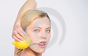 Innovative battery technology. lemon battery. woman with nail at lemon. vitamin for skincare. energy and positive mood
