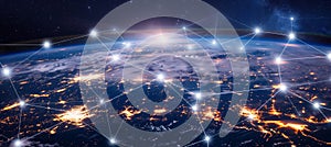 Innovative perceptron lines creating a global network connection engulfing the earth photo
