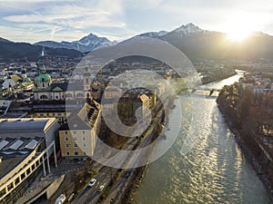 Innsbruck at evening, Aerial Drone Shot of a Beautiful winter City Skyline, Surrounded by Alps Mountains in Austria
