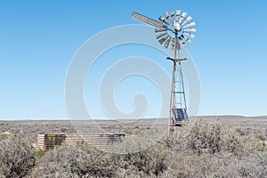 Inoperative windmill, used as solar panel platform