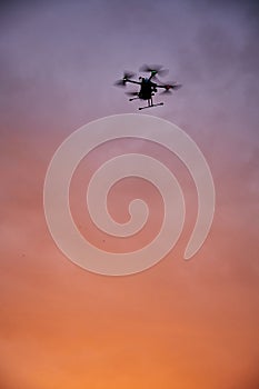 inovation drone with automated external defibrilator aed flying in sunset