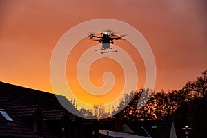 inovation drone with automated external defibrilator aed flying in sunset