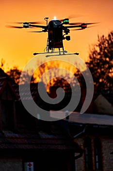 inovation drone with automated external defibrilator aed flying in sunset