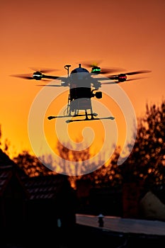 inovation drone with automated external defibrilator aed flying in sunset