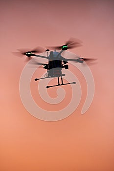 inovation drone with automated external defibrilator aed flying in sunset photo