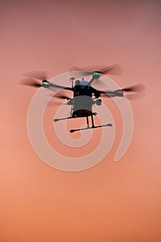 inovation drone with automated external defibrilator aed flying in sunset photo