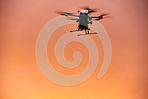 inovation drone with automated external defibrilator aed flying in sunset photo