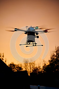 inovation drone with automated external defibrilator aed flying in sunset photo