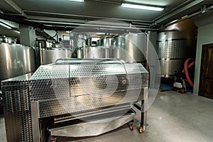 Inox wine barrels stacked in modern winery cellar in Spain