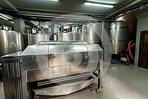 Inox wine barrels stacked in modern winery cellar in Spain photo