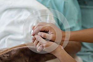 inpatient hand holding from relative or family