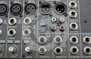 Inputs and outputs of an analog audio mixer with eight channels photo