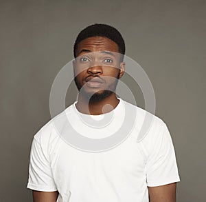 Inquiry facial expression, black man