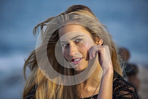 Inquisitive young woman with glance photo