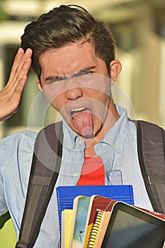 Insane Male Student With Notebooks