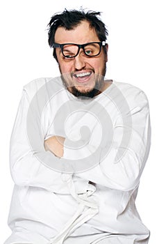 Insane man in strait-jacket isolated on white photo