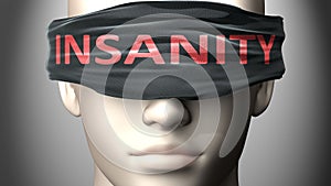 Insanity can make things harder to see or makes us blind to the reality - pictured as word Insanity on a blindfold to symbolize