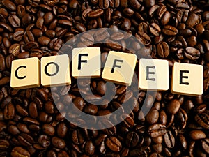 Inscript coffee written on cubes on coffei beans photo