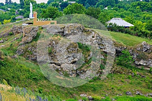 Inscription 1613 Varatic Welcome in Romanian. Entrance to the Moldovan village. Background