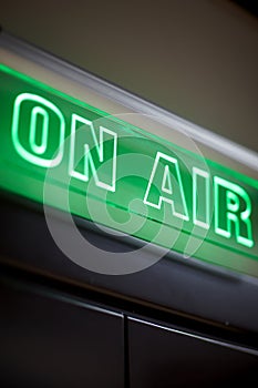 The inscription on air on a green scoreboard of the radio station