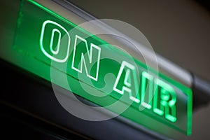 The inscription on air on a green scoreboard of the radio station