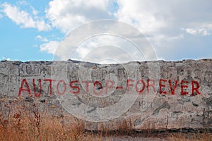 Inscription Autostop forever on wall