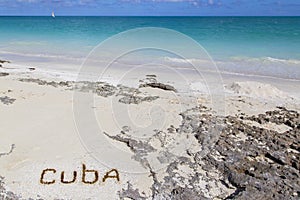 Inscription on the beach sand .Cuba.