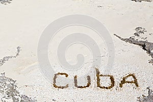 Inscription on the beach sand .Cuba.