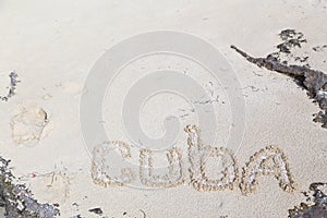 Inscription on the beach sand .Cuba.