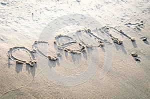 the inscription on beach sand