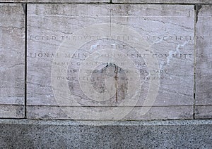 Inscription below the sculptures representing Justice at the base of the Maine Monument, New York City