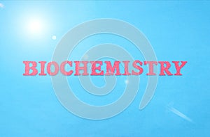 Inscription biochemistry in red letters on a blue background. The concept of a biochemical analysis of blood in humans for various