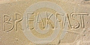 Inscription Breakfast on sand
