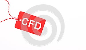 The inscription CFD Contract for Difference on a red price tag on a light background. Advertising concept. Copy space