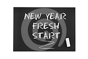 Inscription in chalk on black paper: New year, fresh start