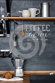 Inscription `Coffee Menu` with chalk on a black wall Kitchens in the style of Loft and Rustic.