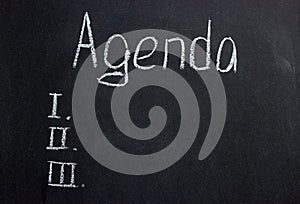 The inscription on a dark board Agenda with serial numbers