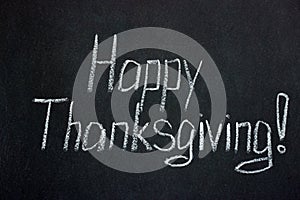 The inscription on the dark board `Happy Thanksgiving Day! `. Holiday in the USA