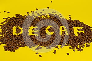 Inscription on decaffeinated coffee beans, top view of coffee.