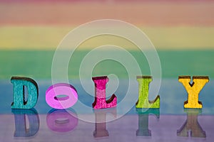 Inscription dolly on background of lgbt flag