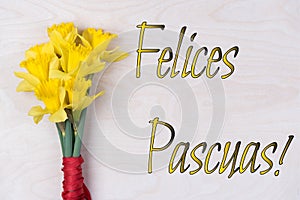 Inscription Felices Pascuas with fresh flowers photo